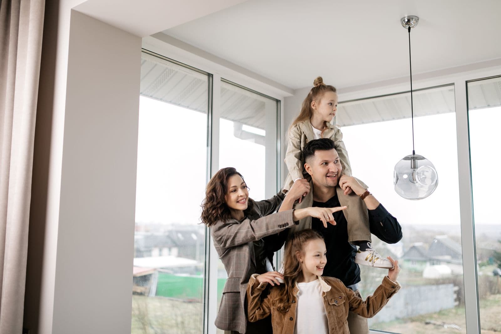 A happy family enjoying their new home after closing.